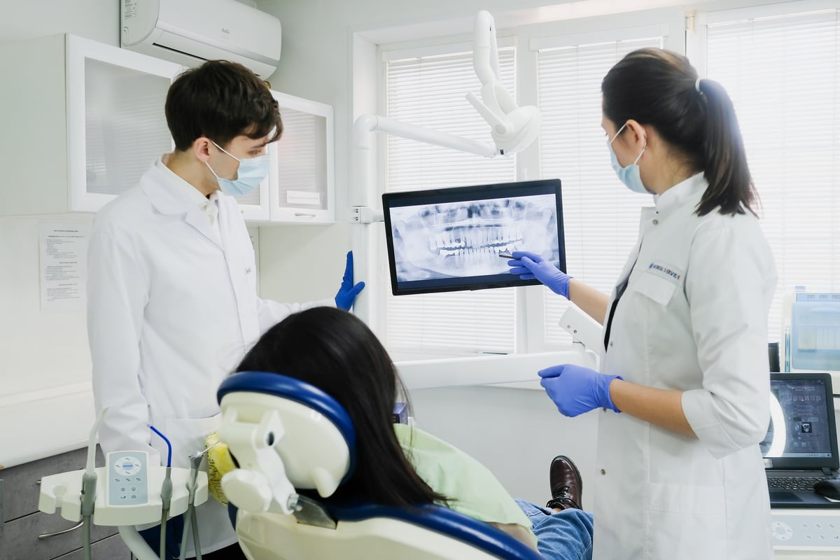 Man and Women Looking at X-ray 